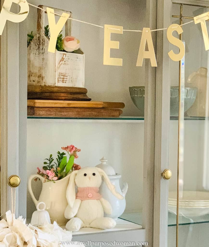 Picture of sock Easter bunny sitting in a gray hutch